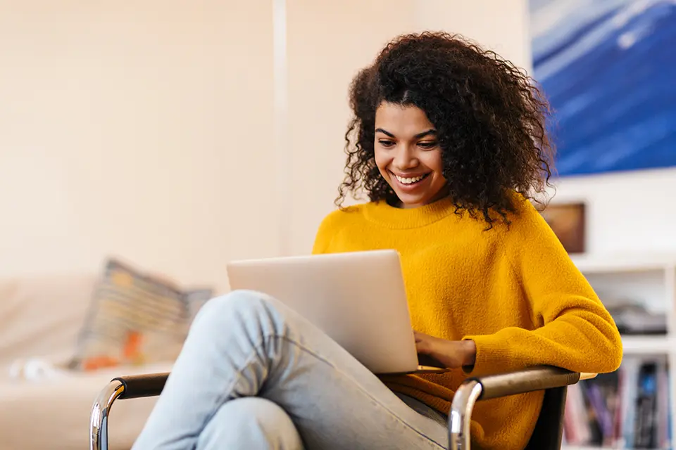 Woman looking at laptop