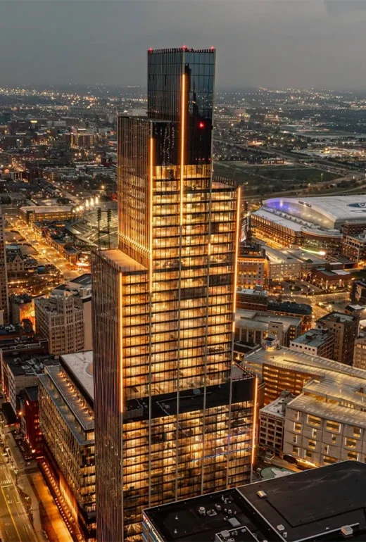 The Hudson Building in Detroit, Michigan stands tall at night time